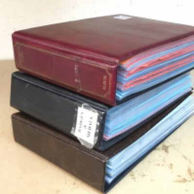 Three albums containing military cigarette cards including Wills, Players, Ogdens, Churchmans etc