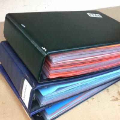 Three albums containing transport cigarette cards including Wills, Players and many different trade cards