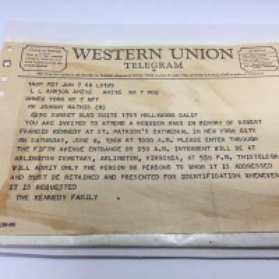 A Western Union telegram sent to Johnny Mathis from the Kennedy family inviting Mr Mathis to attend a requiem mass in memory of Robert Kennedy on Saturday, 8th June 1968. Shipping category A.