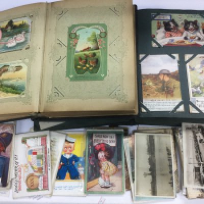 Two postcard albums and loose postcards. Includes WW1 examples. Shipping category C.