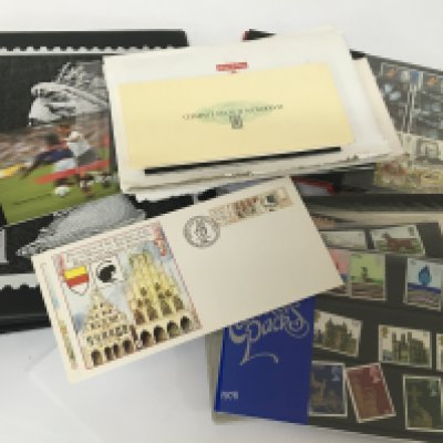 A collection of British stamps mainly unused Queen Elizabeth II stamps presentation packs predominantly unused pictorial.