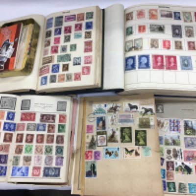 Four albums of world and GB stamps plus some loose stamps. Shipping category B.