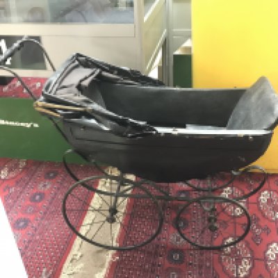 A late 19th century wooden dolls pram by F.A Whitney carriage co Leominster Massachusetts USA