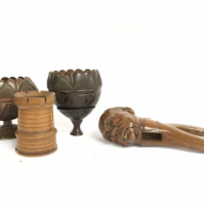 19th century carved coconut shells, a dice holder and a treen nutcracker. Postage category C. NO RESERVE