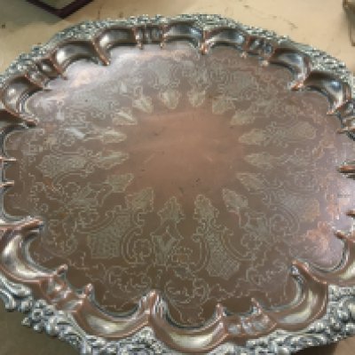 A Victorian heavy copper dish with silver plated border