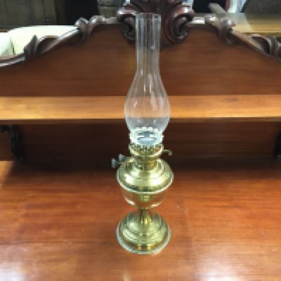 A brass oil lamp. 53cm tall. Postage D