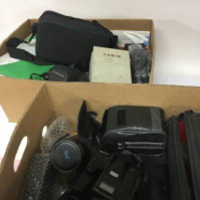 Two boxes containing cameras and equipment an Olympus Camera an unusual 35mm digital camera maker Mirri Japan. and other accessories.