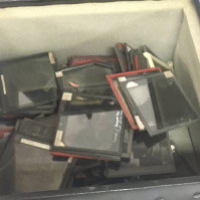 A collection of lantern slides Newton & Co Fleet Street London Middle Eastern and Oriental scenes. With a vintage brass and painted metal projector.