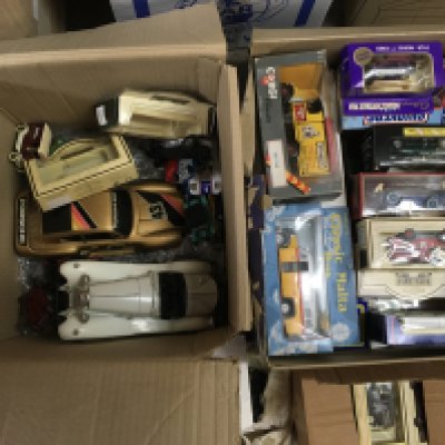 Two boxes of die cast model vehicles comprising Models of Yesteryear and Burago examples. Shipping category D.