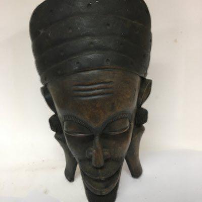 A large carved African tribal wall mask heigh 62cm