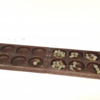 An African carved hardwood Mancala game.