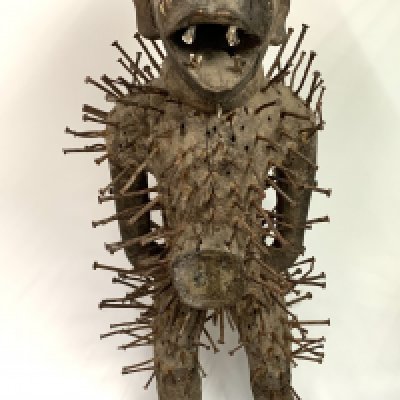 Tribal Art of Central Africa, Early Konganese figure of a Kondi, (Nkonidi) a mystical hunter statue used to ward of evil spirits or people with impure thought. Wooden glass, canvas and nail construction. Standing 86cm high.