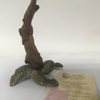 An interesting Ancient Egyptian wooden carving on a carved stone base 600-400 BC with certificate of Authenticity from Coincraft Great Russell Street London cost &#2013266083895. Height 29cm