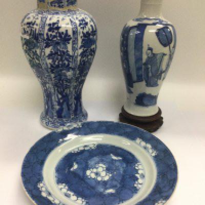 Three blue and white Oriental ceramics comprising two vases and a plate, approx diameter 21.5cm. Shipping category D.