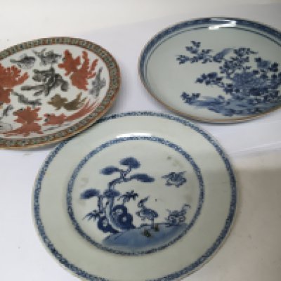 A Chinese late 18th century Export porcelain blue and white dish with a raised edge one other plate (damaged) and a Chinese dish decorated with fish. (3)