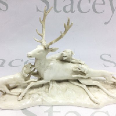 A Nymphenberg porcelain figural group of a hunting scene, approx height 16cm. Shipping category D.