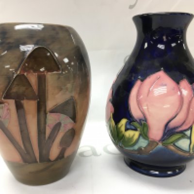 Moorcroft vases, magnolia and mushroom patterns. 18 & 19.5 cm tall. This lot cannot be posted
