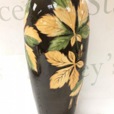 A Moorcroft chestnut leaves vase , 31cm tall. This lot cannot be posted, no obvious damage or restoration