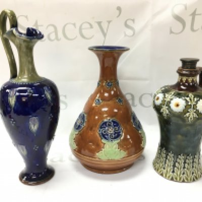 Royal Doulton Lambeth stoneware vases including a claret jug, Whiskey flagon. No obvious damage or restoration. 23 to 30cm tall approximately. This lot cannot be posted