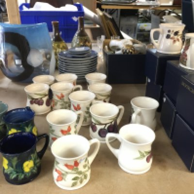 A collection of ceramic Moorcroft mugs and some boxes. This lot cannot be posted