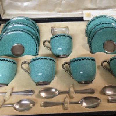 A cased Set of five Royal Worcester coffee cups saucers and silver plated spoons.
