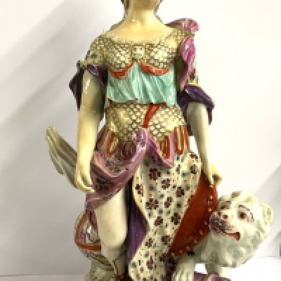 A large Derby porcelain figure, Britannia, circa.1765, standing beside a lion, and with trophies at her feet, patch marks, some possible restoration, 32cm. (D)