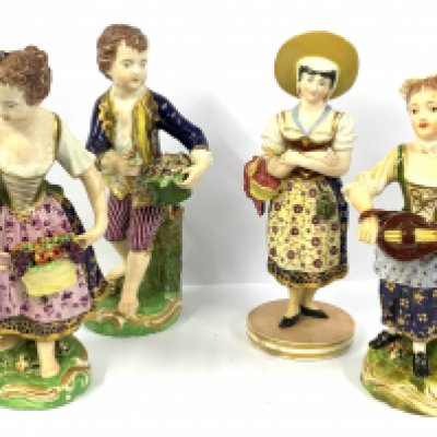 A pair of porcelain figures of children holding flower baskets with Derby marks together with 2 additional figures 1 Flower girl Bloor Derby mark to the underside one additional Derby style porcelain figure of a girl playing a loot. Each approx 15cm. (D)