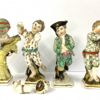 Four early KPM porcelain figures of children depicting months of the year. 10.5cm.