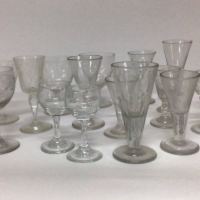 A collection of early 19th century wine and liquor glasses.