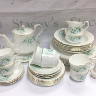 A Royal Stafford bone china tea and dinner set plus a Czechoslovakian tea set with floral spray decoration. Shipping category D.