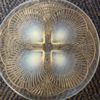 An R Lalique opalescent Coquilles pattern glass dish .