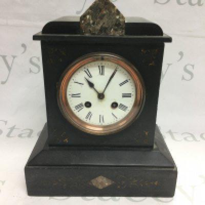 A black slate mantle clock. Shipping category D. NO RESERVE