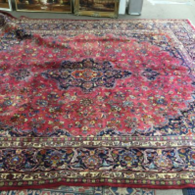 A large Middle East carpet. Approx 293cm wide 355cm long