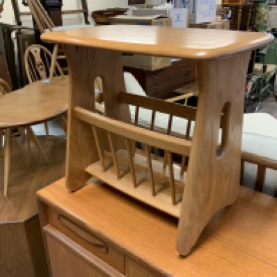 An Ercol Windsor light elm magazine rack, 55cm x 50cm