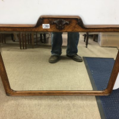 A walnut framed wall mirror. Approx 83 x60cm