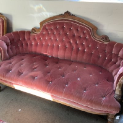 A Large Victorian upholstered sofa together with matching ladies and gents armchairs.