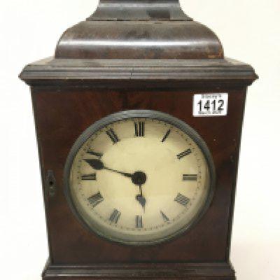 A George III mahogany bracket clock the case with a gilded metal stylised finial fitted with a single brass fusee movement. Hight 48cm Sold without reserve.