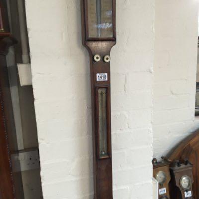 An early Victorian stick barometer with internal thermometer box maker E C Wood Cheepside London. In need of restoration sold without reserve