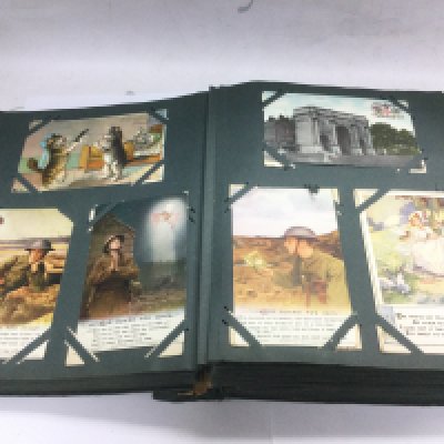 An album containing over 400 postcards including WW1, topographical, humorous etc. Shipping category B.