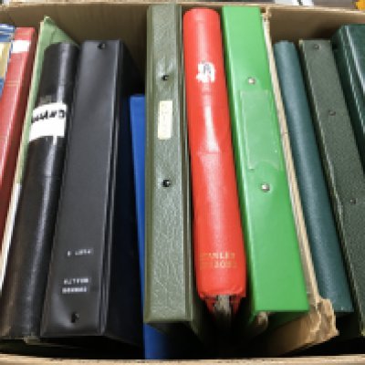 A box of various world stamp albums . Postage category c