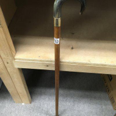 A walking stick with an 18ct gold cuff below the handle. Approx length 85cm.
