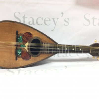 A mandolin with inlaid butterfly design. Postage category C. NO RESERVE