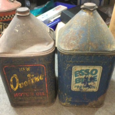 Two vintage 5 gallon oil and petrol cans comprising an Esso Blue and Ovoline Oil examples. Shipping category D.