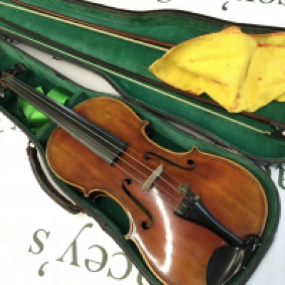 A cased early 20th century violin with label Giovan Paoia Maggini Brefcia 1631. With two bows. Postage category C