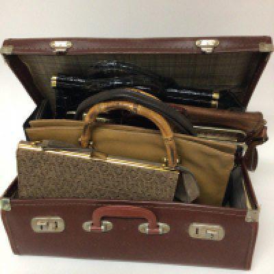 A collection of vintage ladies handbags and a small travelling case