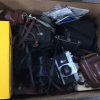 Two boxes of cameras and equipment.