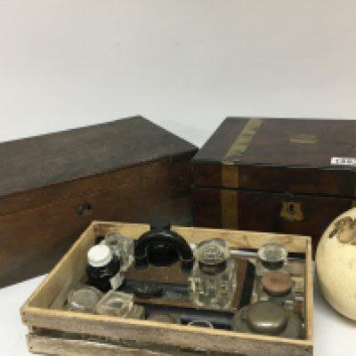 A walnut late Victorian brass bound writing box and a George III mahogany writing box both for restoration a collection of ink well bottles and an ostrich egg.