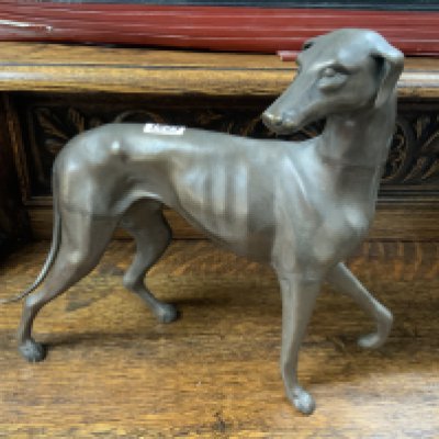 A large bronze figure of a dog. 38cm.