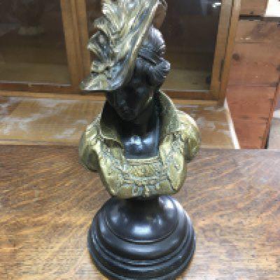 A bronze and gilt metal bust signed rigual.