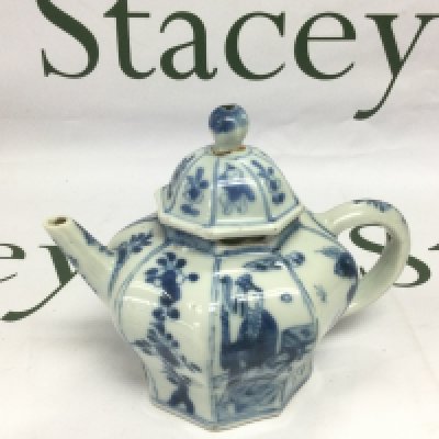 A small blue and white teapot decorated with various figures, approx height 11.5cm, some damage. Shipping category D. NO RESERVE